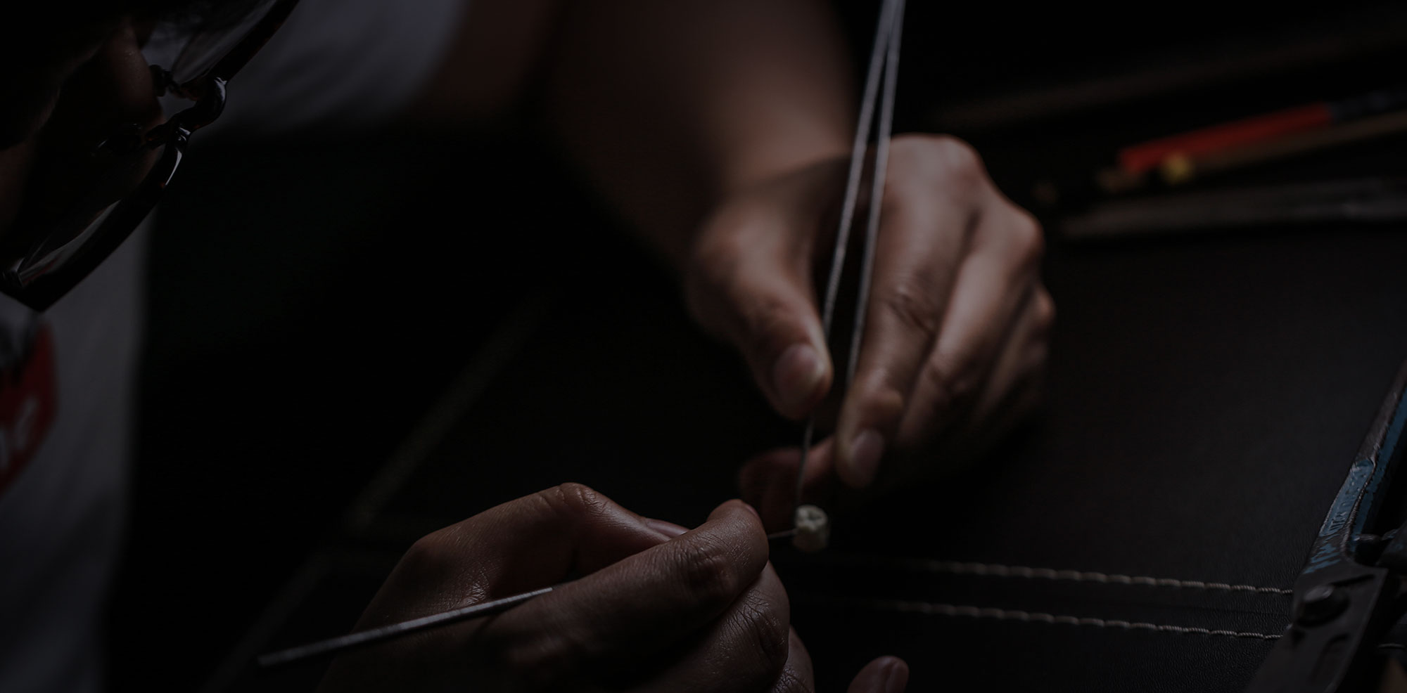 Close-up stitching detail on silicone leather material